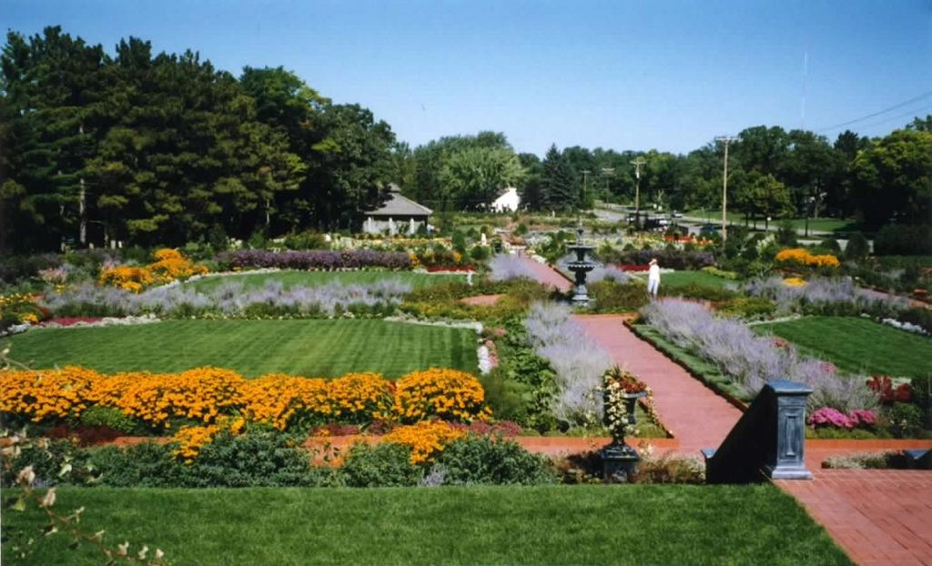 Large garden with pathways and a gazebo in the background