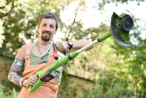 person trimming a lawn