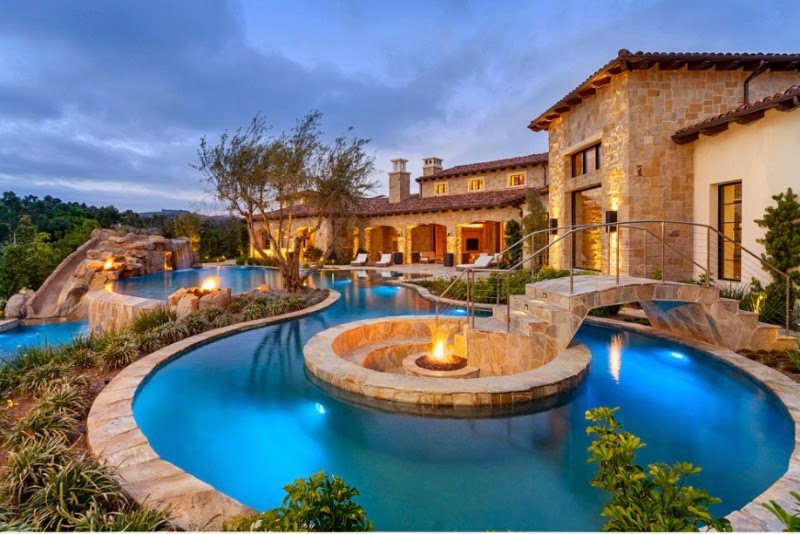 Pool in a backyard of an extravagant house