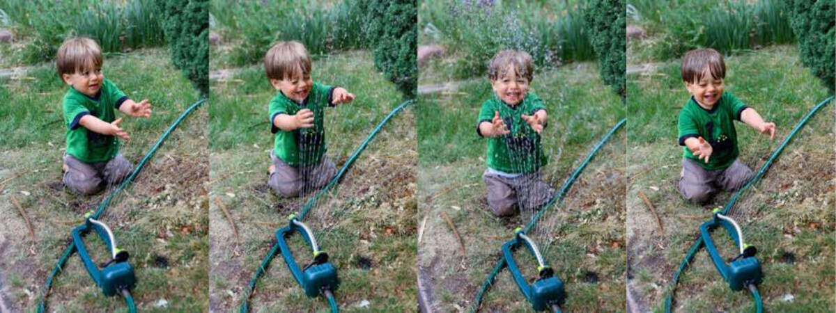 Kid watering lawn with fun