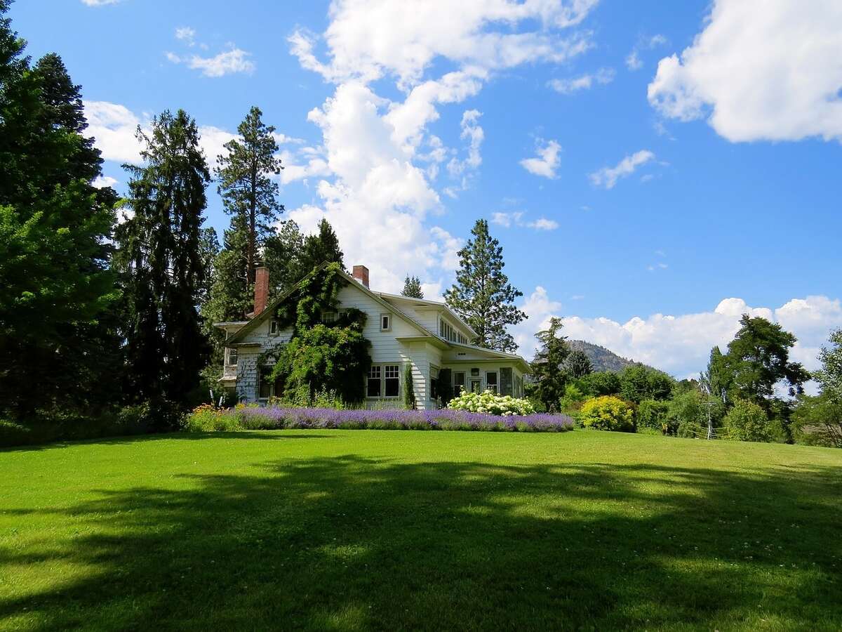 lawn in front of a house with blue sky
