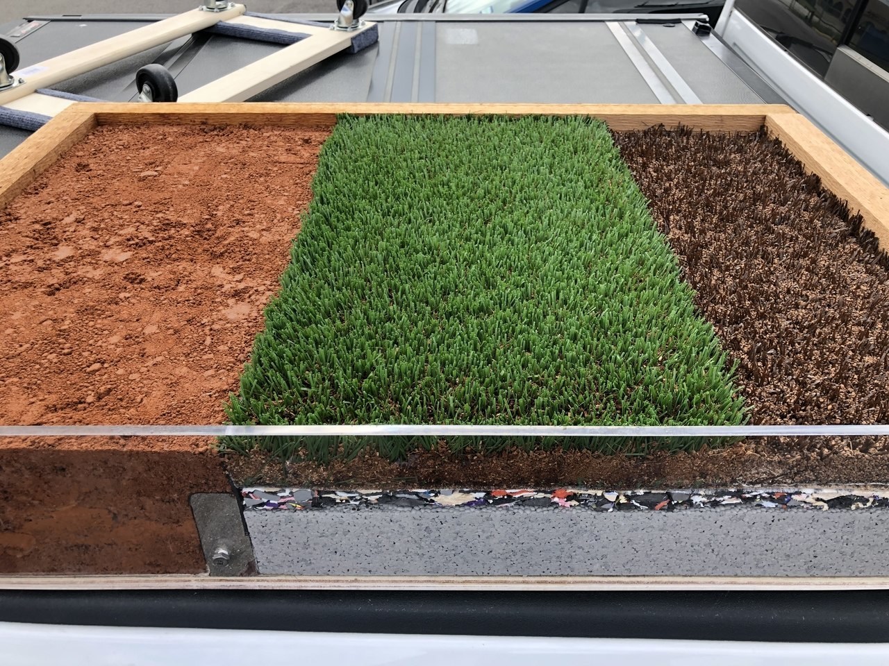 Modern artificial turf with a soft absorbent layer beneath