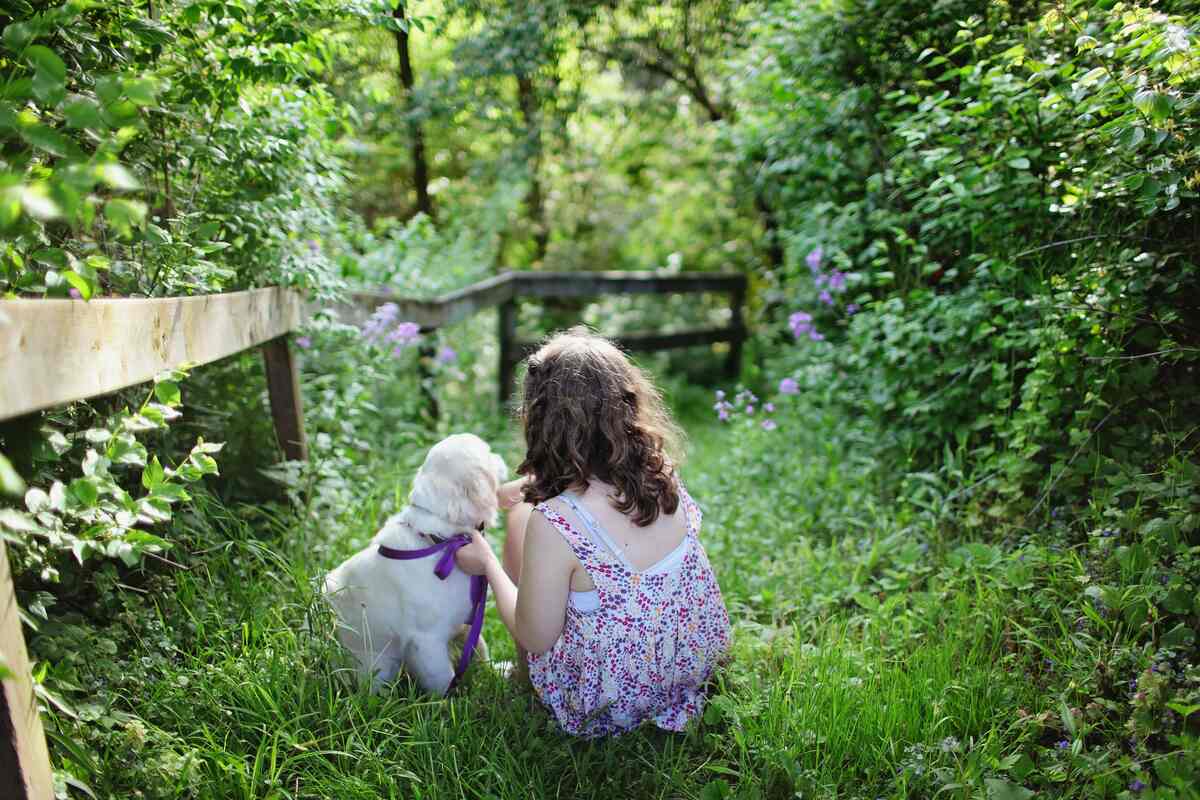 dog and a girl in garden