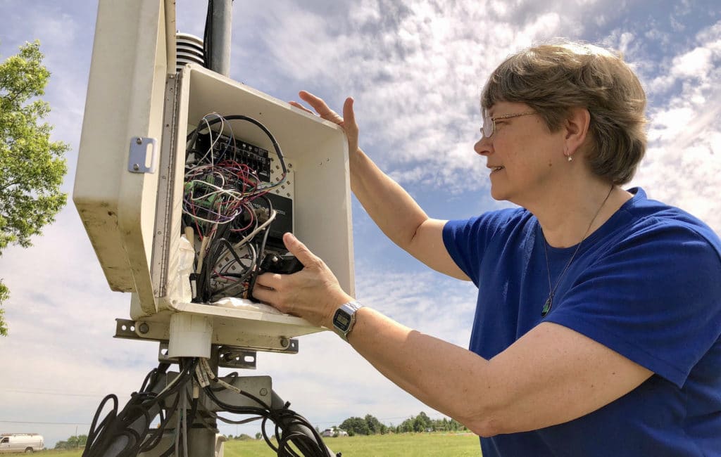 Pam Knox, University of Georgia, checks a weather station.