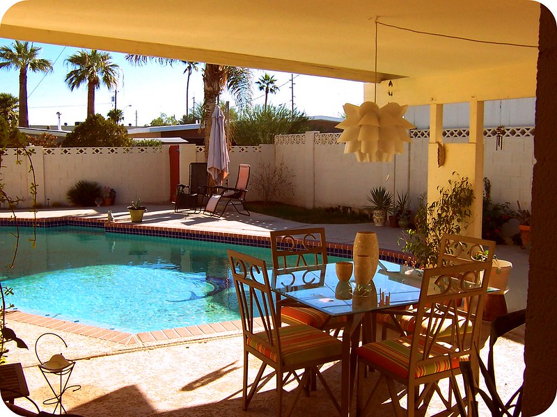 Hardscape and patio furniture around a pool