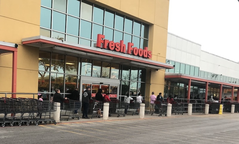 Some groceries, like this one in Central Texas, admit customers a few at a time to keep crowds manageable.