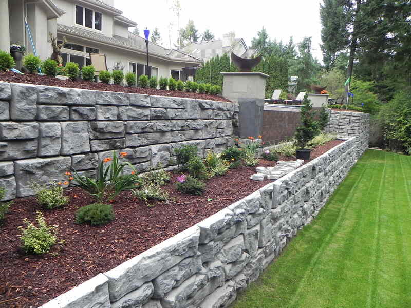 Stacked retaining walls with raised flower beds