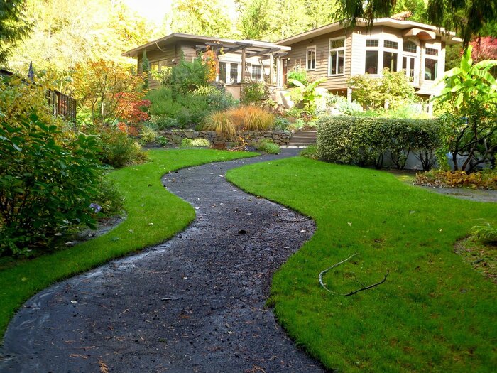 Edging along a pathway to a home makes for a well-manicured front lawn