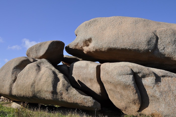 Large granite boulders against blue sky