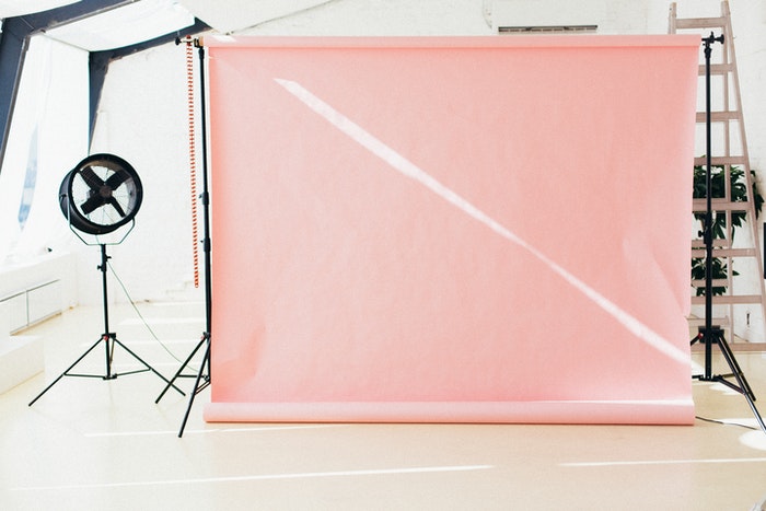 Photography studio with pink photo background