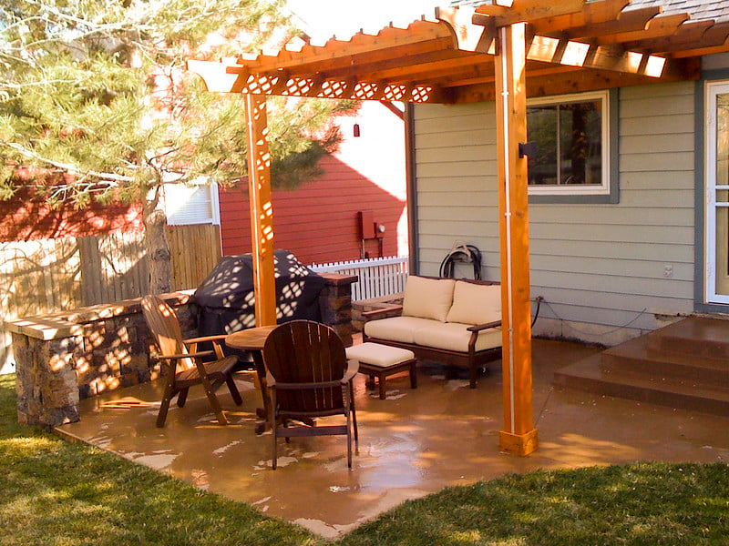 Attached wooden pergola used as patio cover