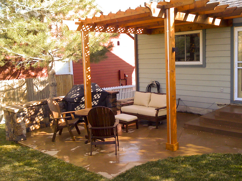 Attached wooden pergola used as patio cover