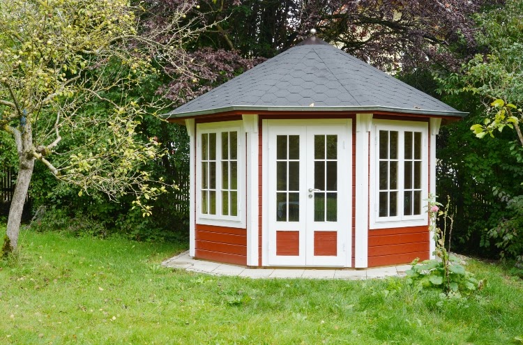 Reddish-brown and white gazebo with walls and doors