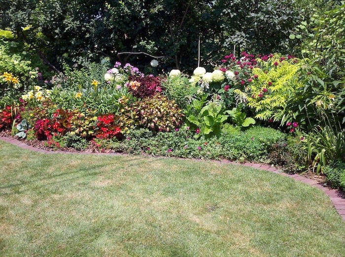 Flower bed with brick edging