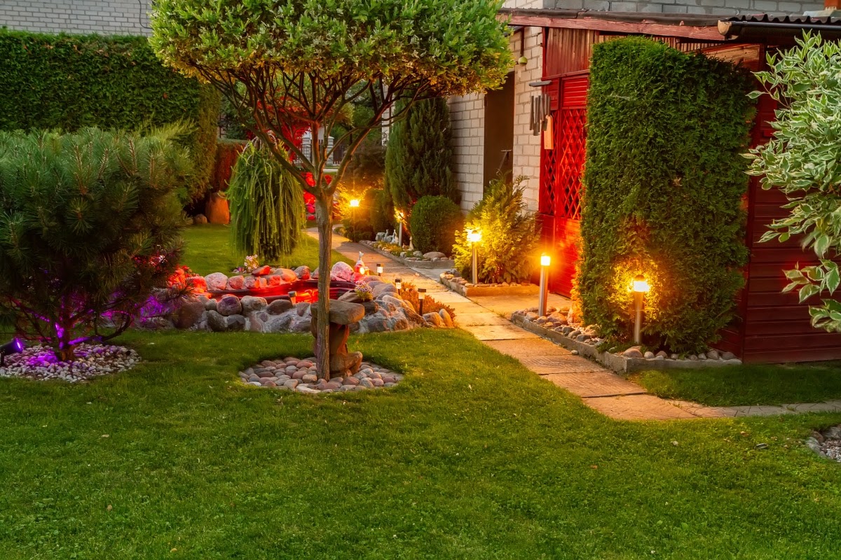 A garden walkway lined with solar path lights