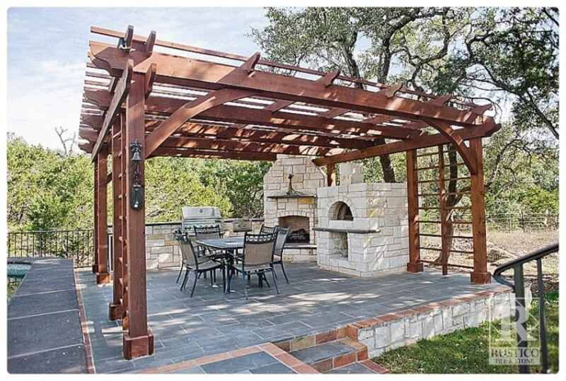 wooden pergola over outdoor kitchen