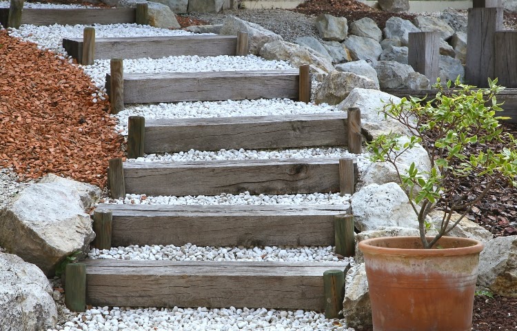 pea gravel and landscape timbers stairway leading into garden