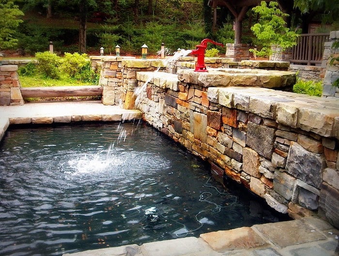Fountain at Cathedral Caverns surrounded by natural stone hardscape