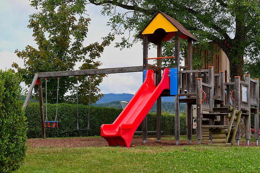 Children's playground with slide and swings