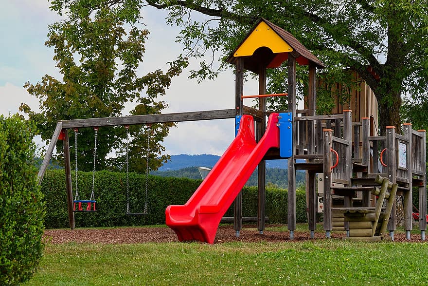 Children's playground with slide and swings