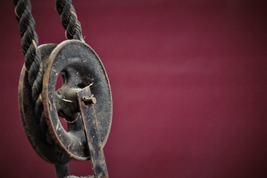 A pulley with a purple background