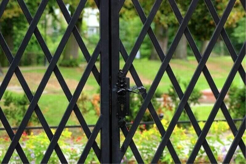 Close up of metal gate with lattice work