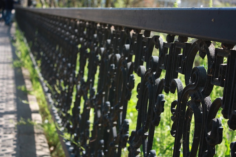Close up of a decorative wrought iron fence