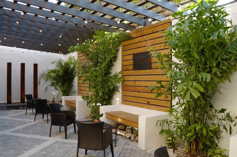 Seating area under an attached pergola