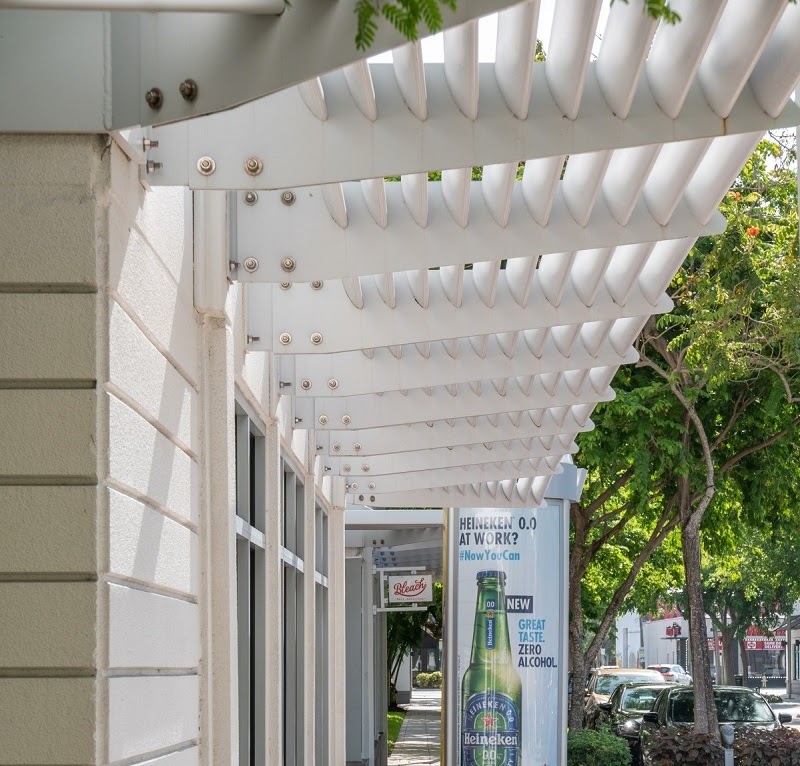 White awning pergola over windows