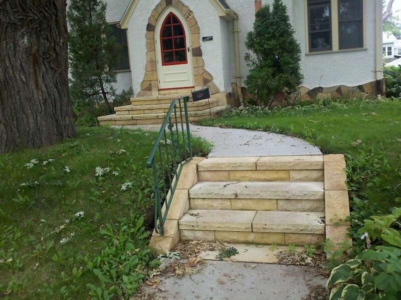 Two small sets of outdoor stairs lead to front door.
