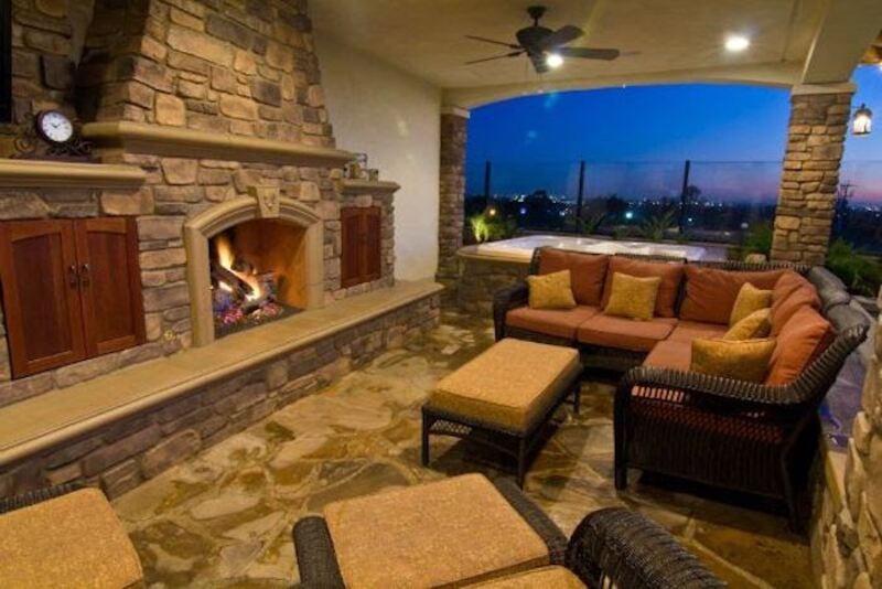 Outdoor living area with hardscape roof support columns.