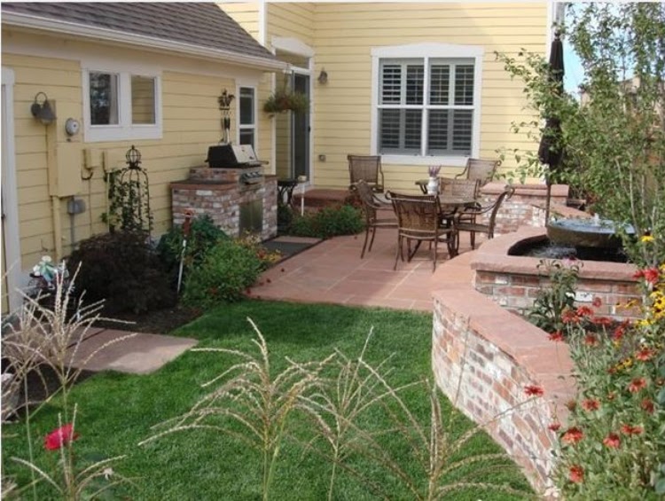 small patio with outdoor kitchen and dining set