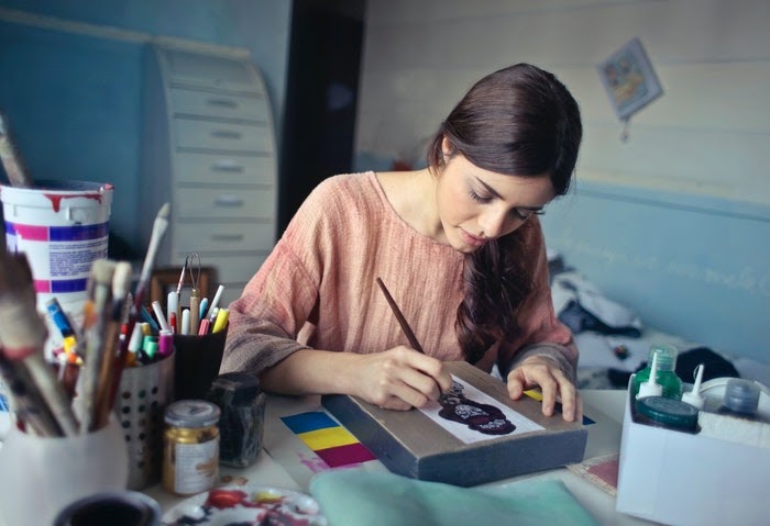 Artist studio she shed idea featuring a painter working on artwork