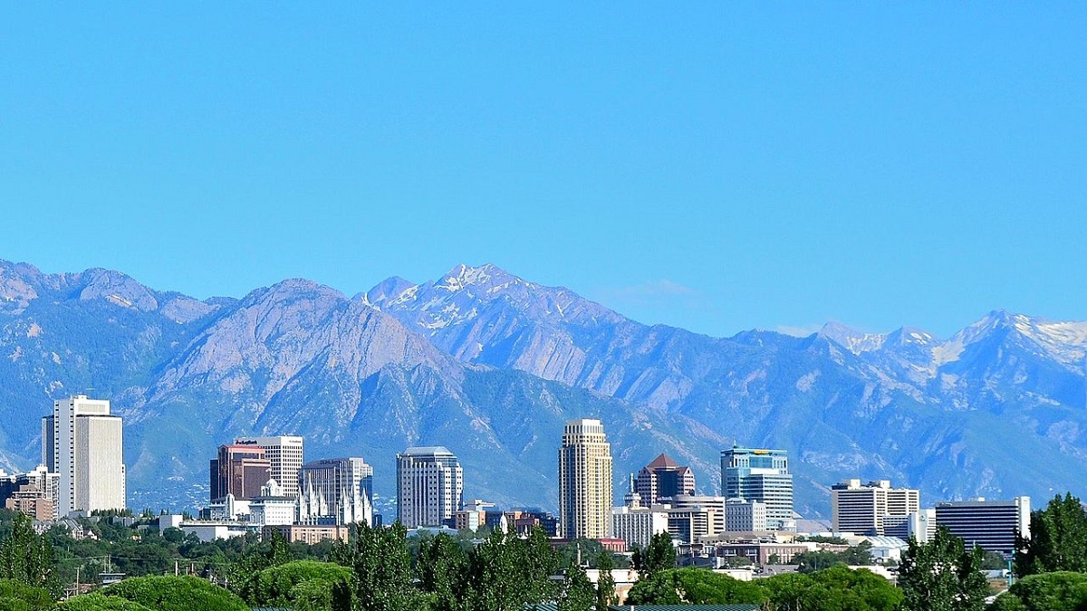 Salt Lake City skyline with forests and mountains in the background
