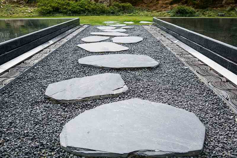 A picture showing greyish stepping stone pathway