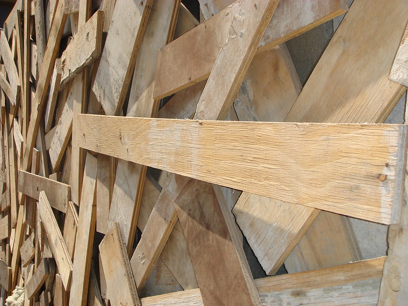 Mismatched wood boards making up a fence