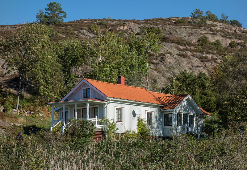 House surrounded by mountains and trees