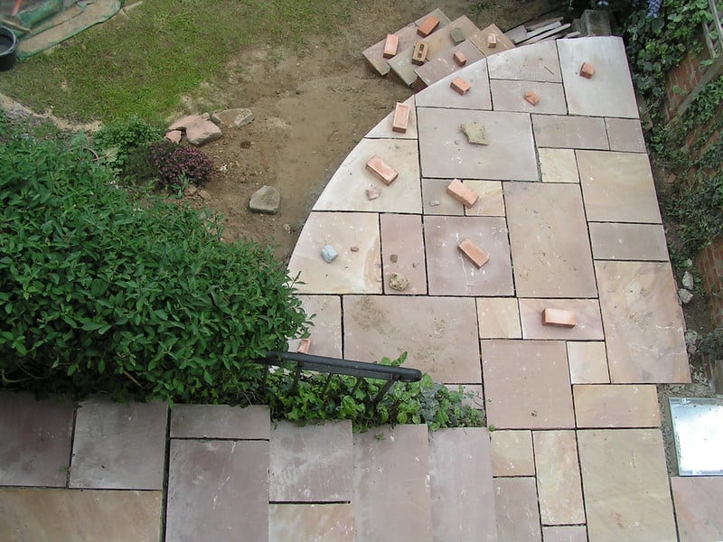 Partially built patio using pavers and brick