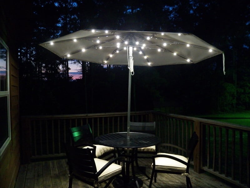 String lights under and outdoor umbrella