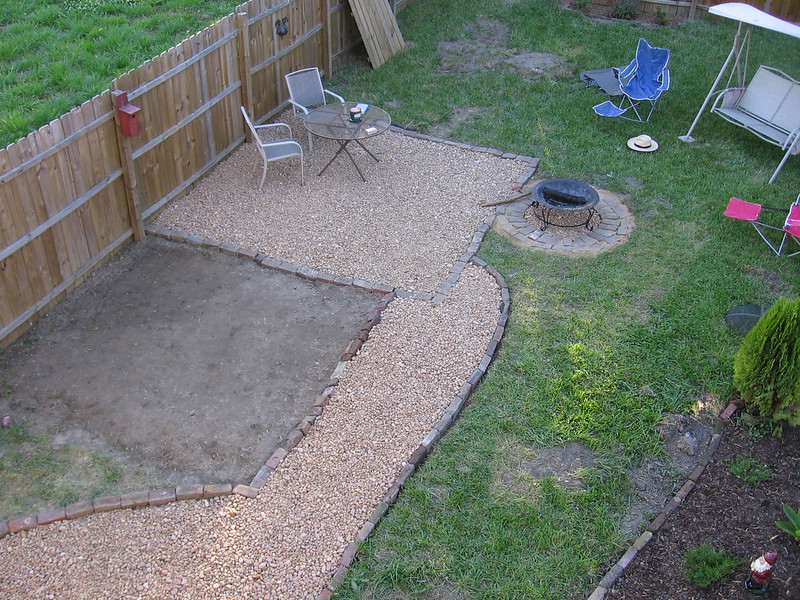 Aerial shot of a backyard with a patch of ground being prepped for building on top of it