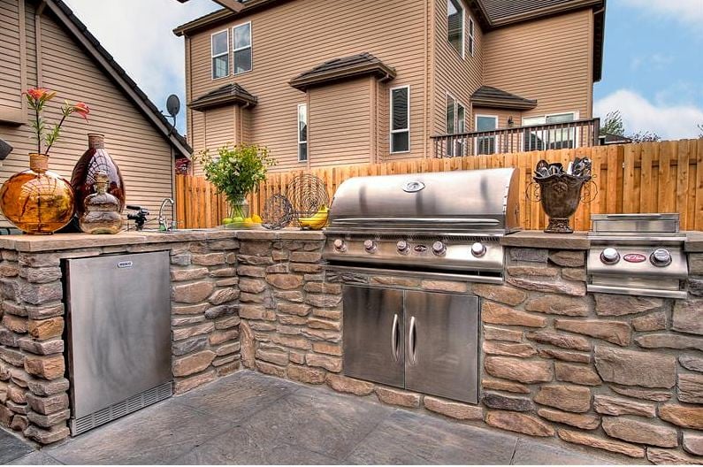 Custom outdoor kitchen made from stone varieties