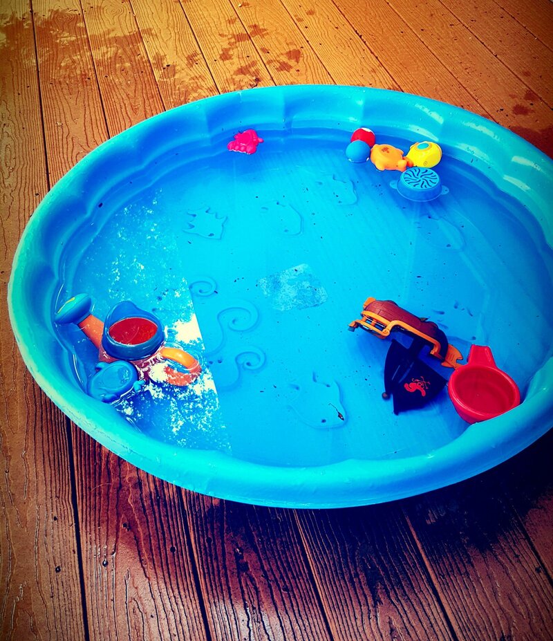 Baby pool on a wood deck
