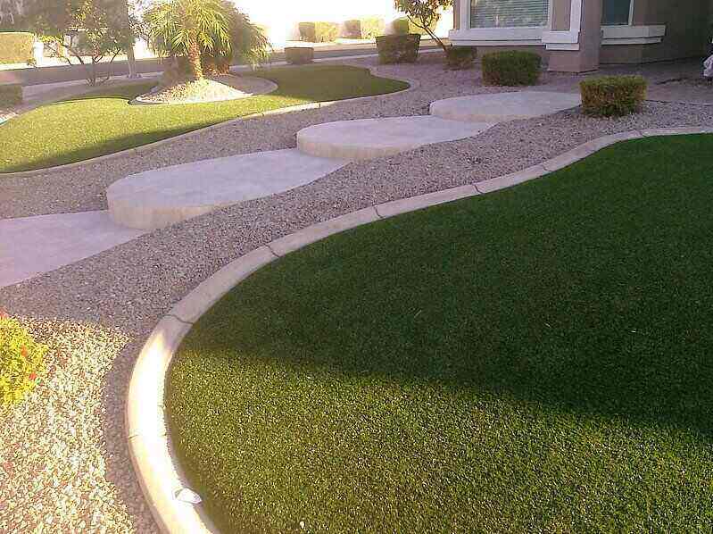Turf grass installed along a front of house walkway