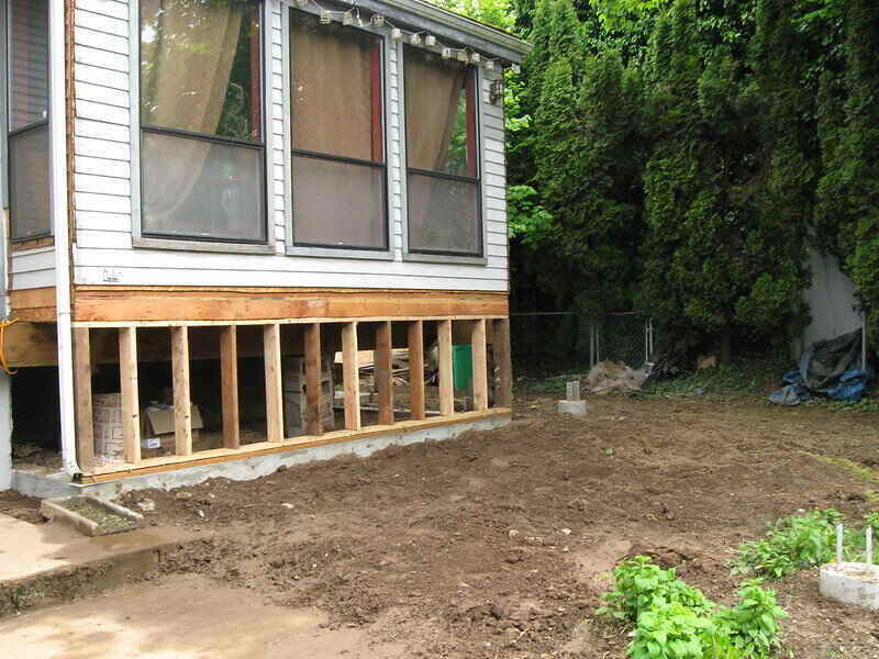 Deck pre-construction on side of a house