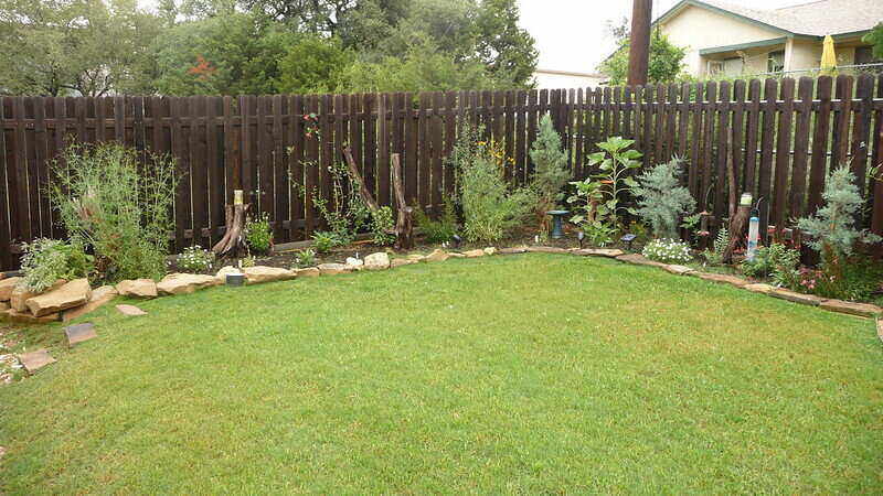 xeriscaping in a fenced-in backyard