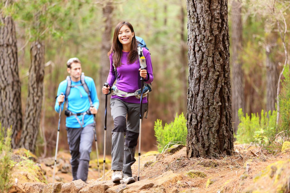 Man and woman hike in the woods