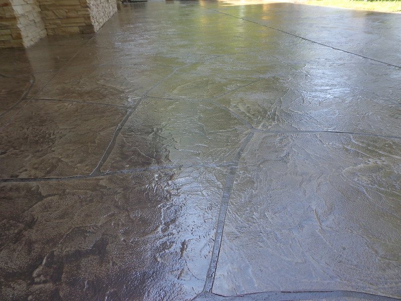 stamped concrete pad with a shiny finish