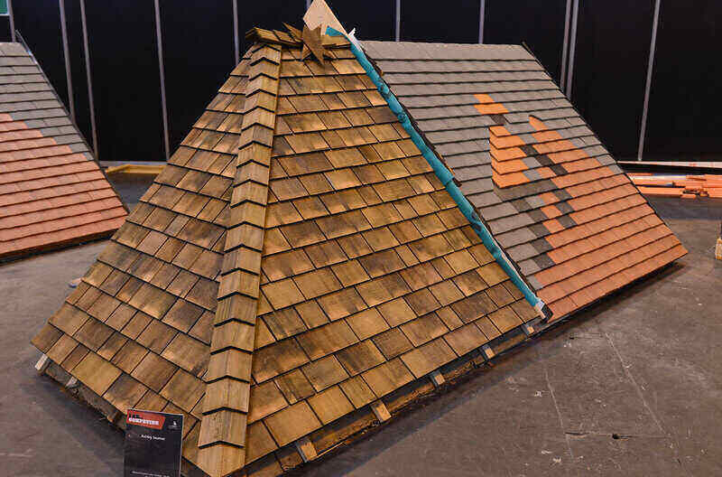 Roofing tile in a pattern to detail a roofer tiling a roof