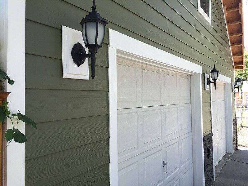 Green cement-board siding on a house