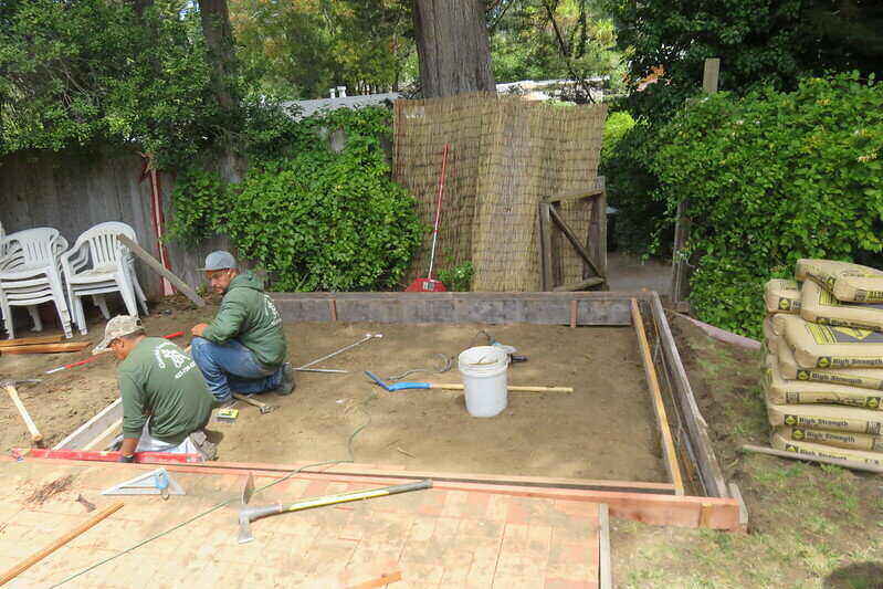 Workers preparing a site for concrete